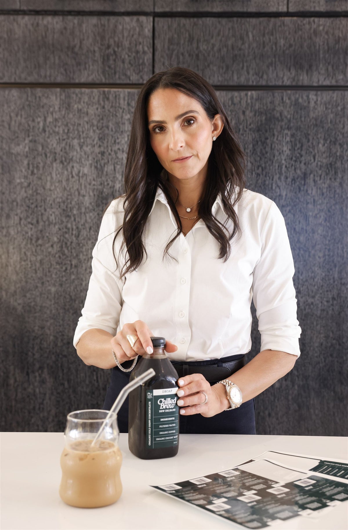 Gail Farca, founder of Chilled Brew, holding a bottle of New Orleans cold brew